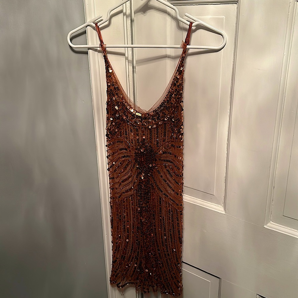 Sparkly bronze New Year’s Eve dress